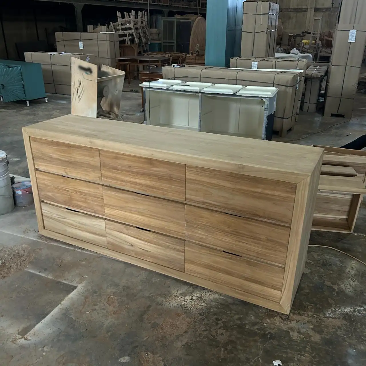 Oka 9-drawer teak console, side angle showing natural grain finish